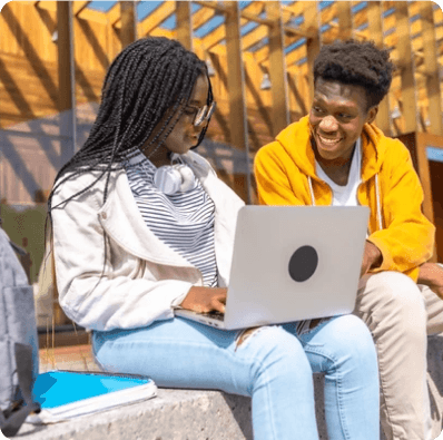 Students collaborating on a laptop